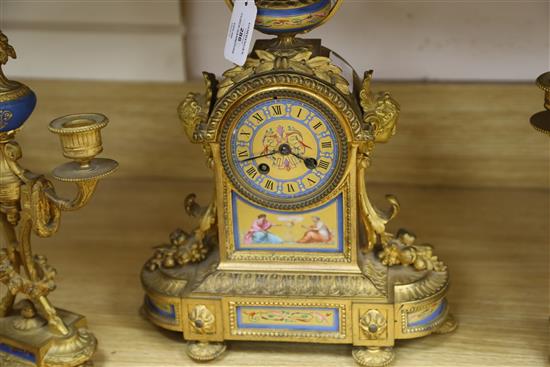 A 19th century French ormolu and porcelain clock garniture